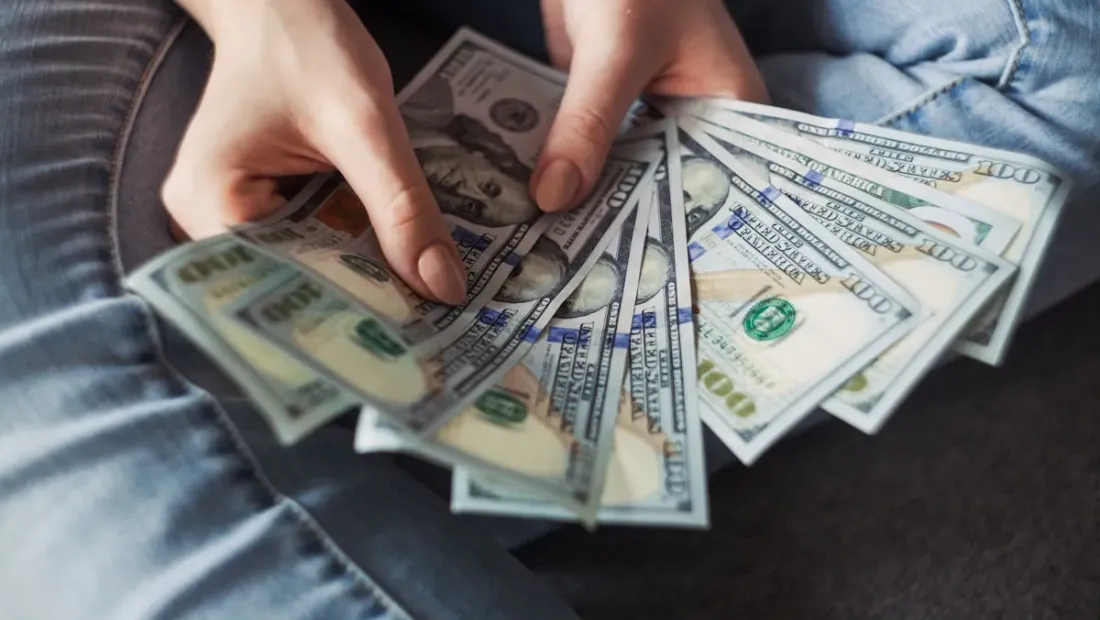 Close-up of a person using Google Maps on a smartphone while searching for local businesses