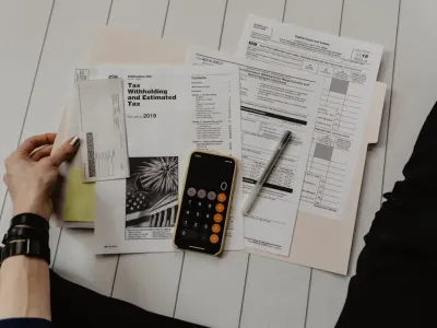 Calculator and financial documents on a desk representing accountant and CPA services