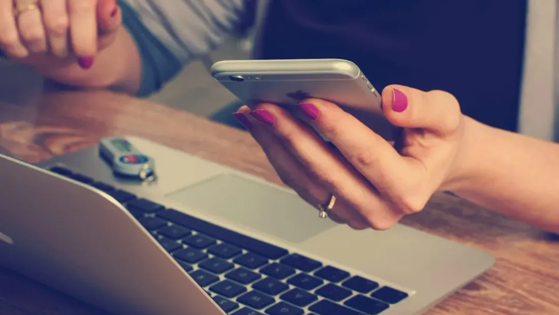 Person searching on a smartphone for a local business