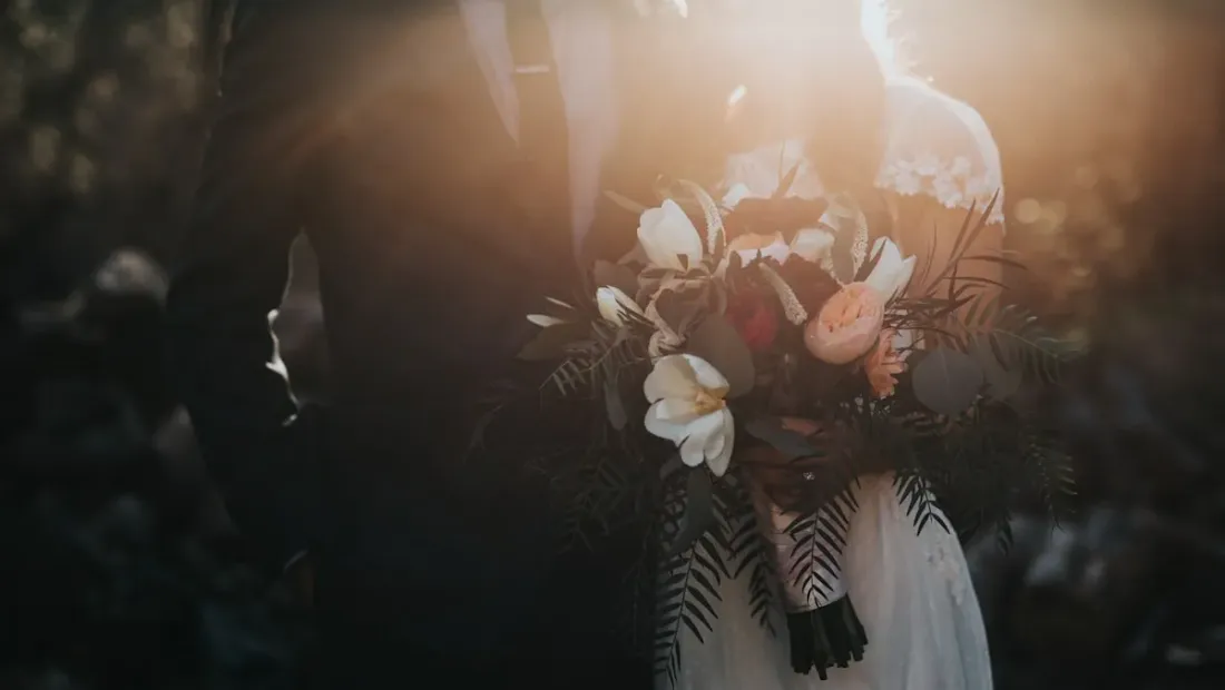 Bride and groom standing together during their wedding ceremony
