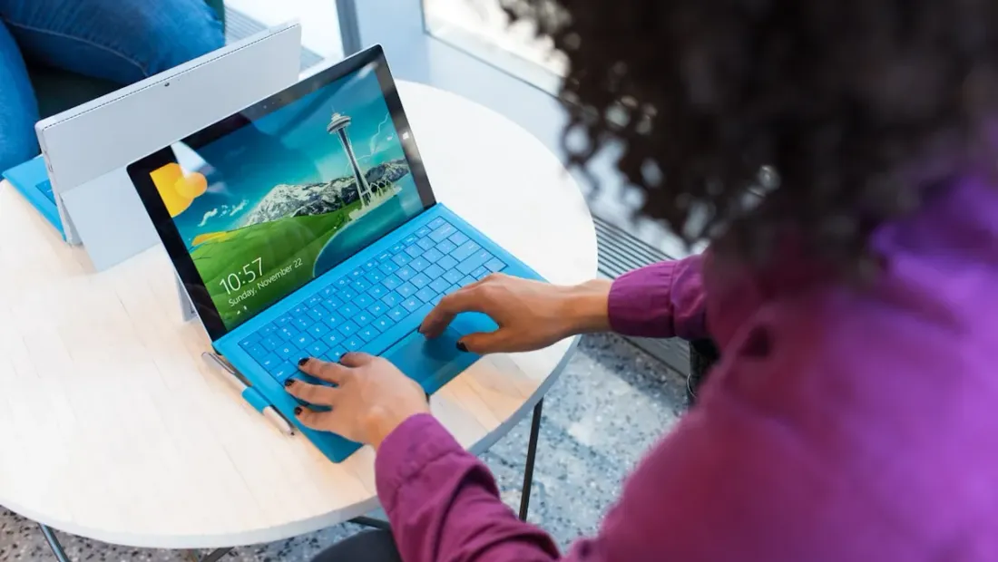 A business owner reviewing their website on a laptop screen showing accessibility testing results