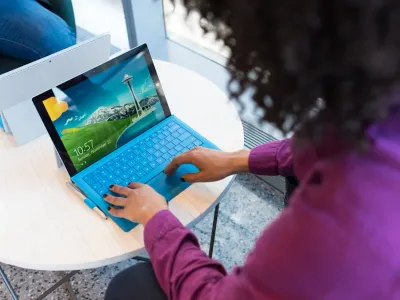 A business owner reviewing their website on a laptop screen showing accessibility testing results
