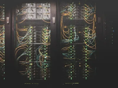 A laptop screen showing a web browser address bar with a domain name typed in