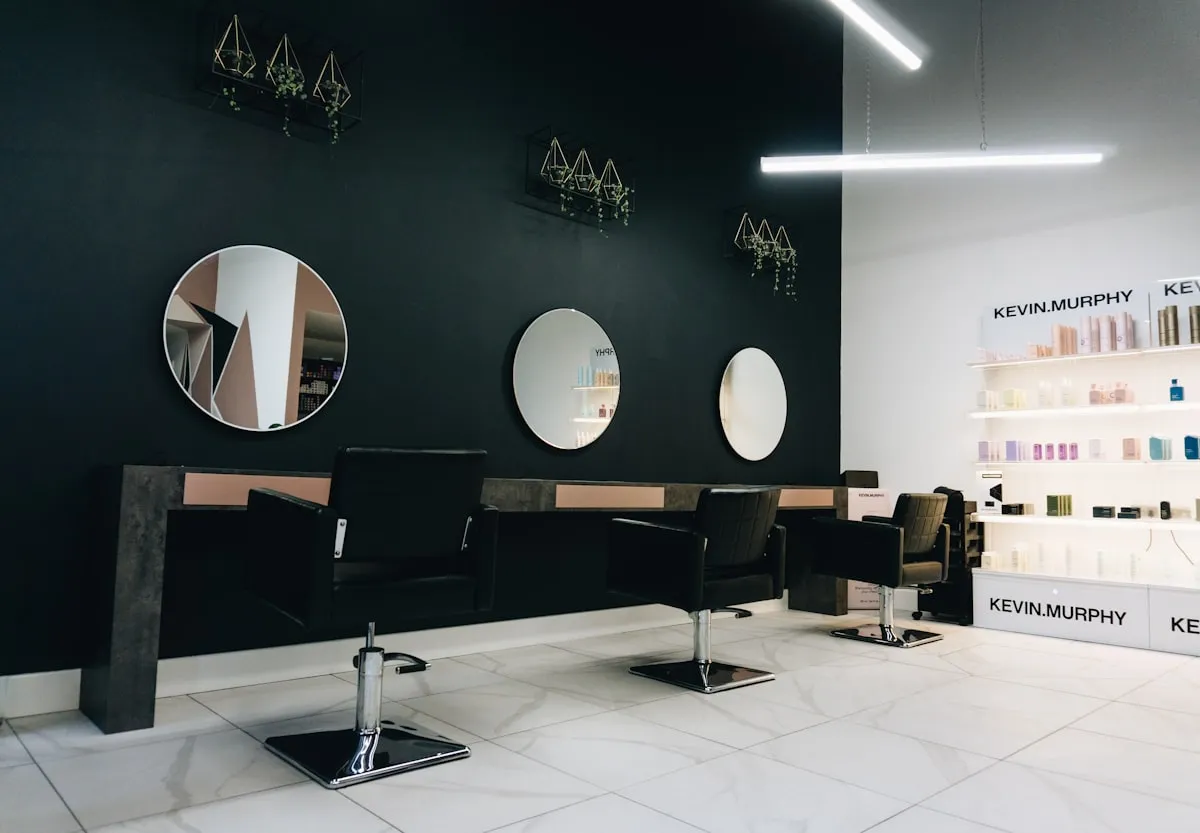 Interior of a modern hair salon with styling chairs and clean decor